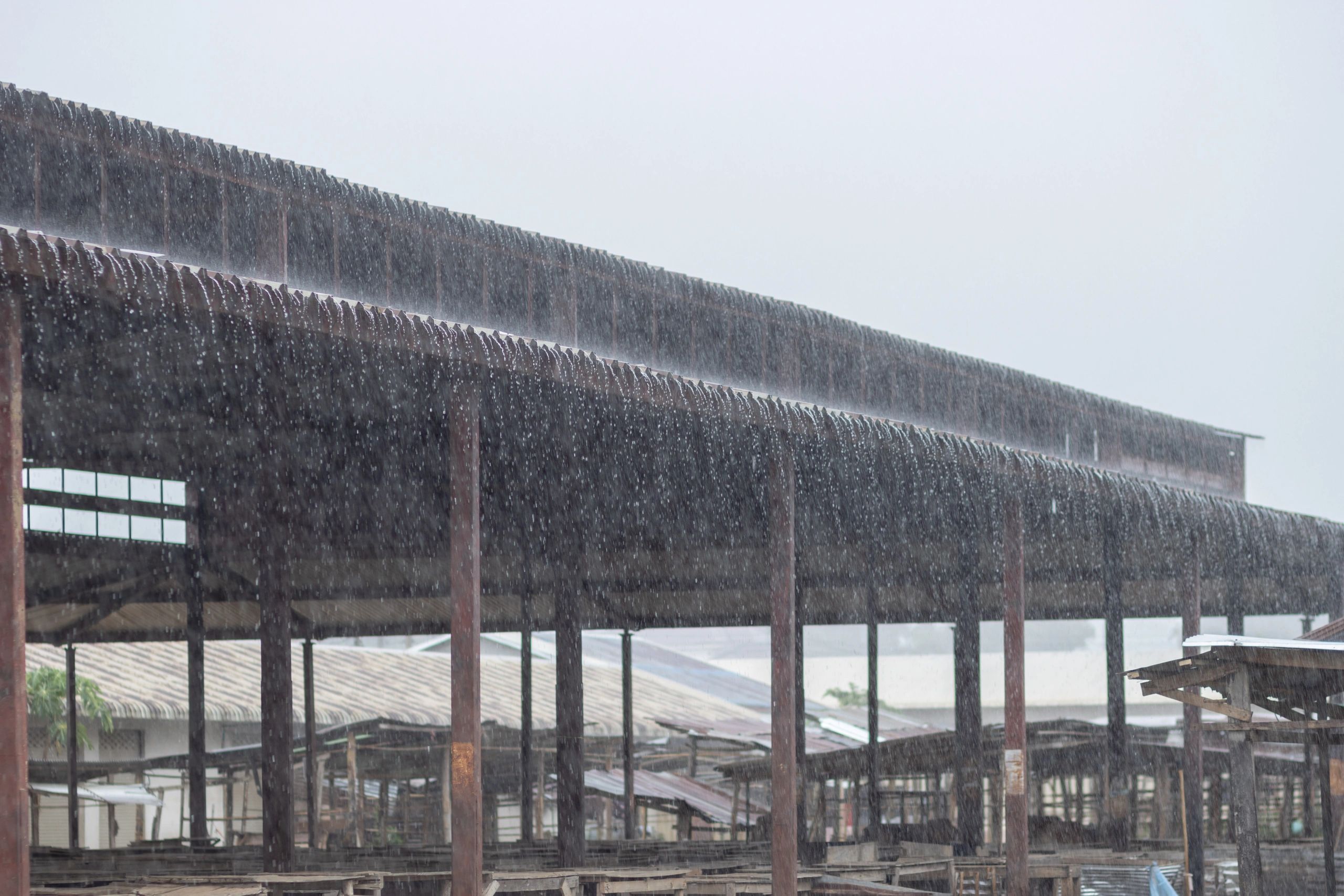Roof under heavy rain during storm conditions